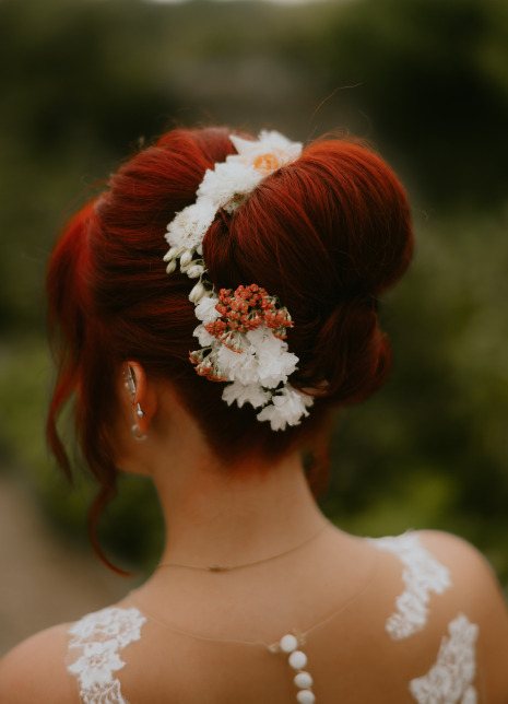 Boho bride with updo and real flowers